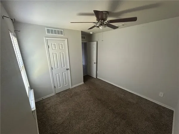 a view of a livingroom with a staircase