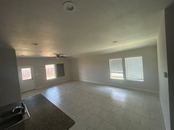 a view of an empty room and window