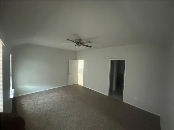 an empty room with a empty space and a window