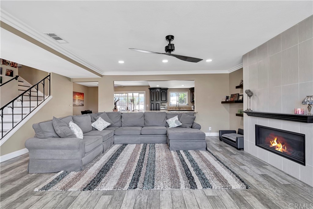 23682 Cavanaugh Road Lake Forest, CA 92630 - Photo 11 of 51 a living room with furniture and a fireplace