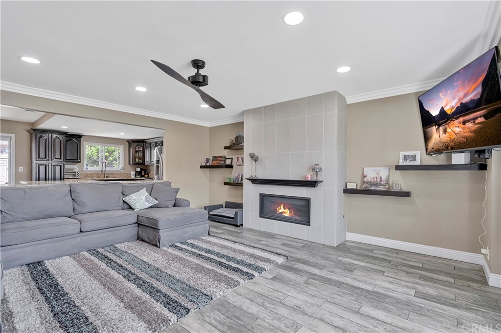 23682 Cavanaugh Road Lake Forest, CA 92630 - Photo 13 of 51 a living room with furniture and a fireplace