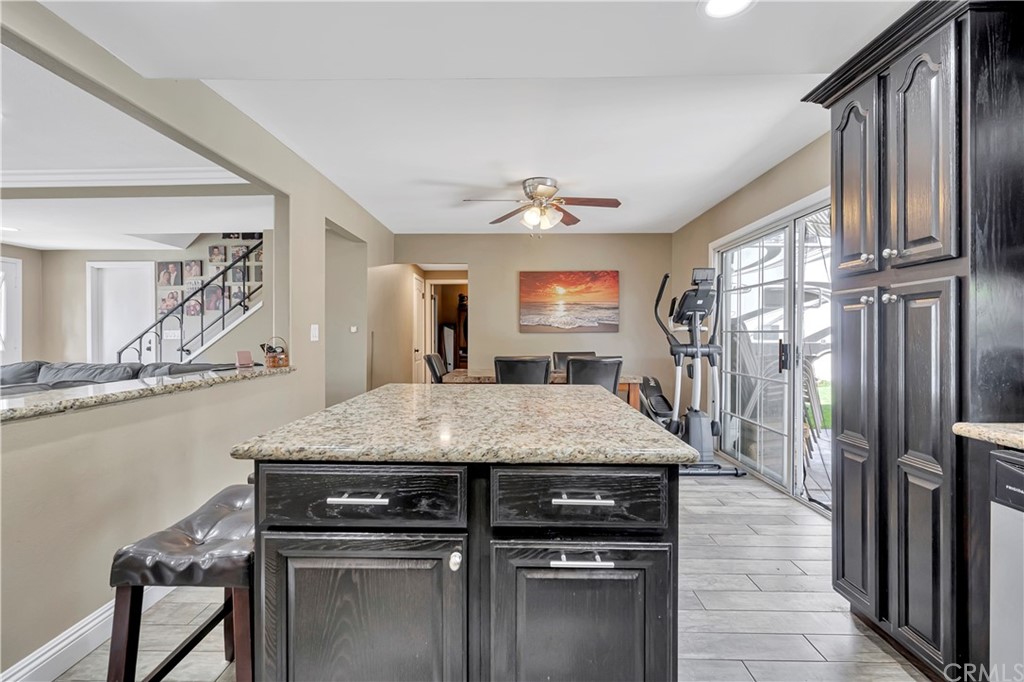 23682 Cavanaugh Road Lake Forest, CA 92630 - Photo 19 of 51 a kitchen with a stove a sink a refrigerator and a dining table
