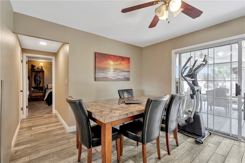 23682 Cavanaugh Road Lake Forest, CA 92630 - Photo 27 of 51 a view of a dining room with furniture and wooden floor