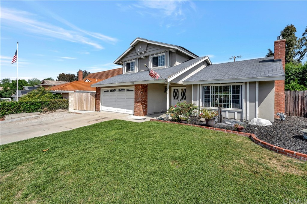 23682 Cavanaugh Road Lake Forest, CA 92630 - Photo 3 of 51 a front view of a house with a yard and porch
