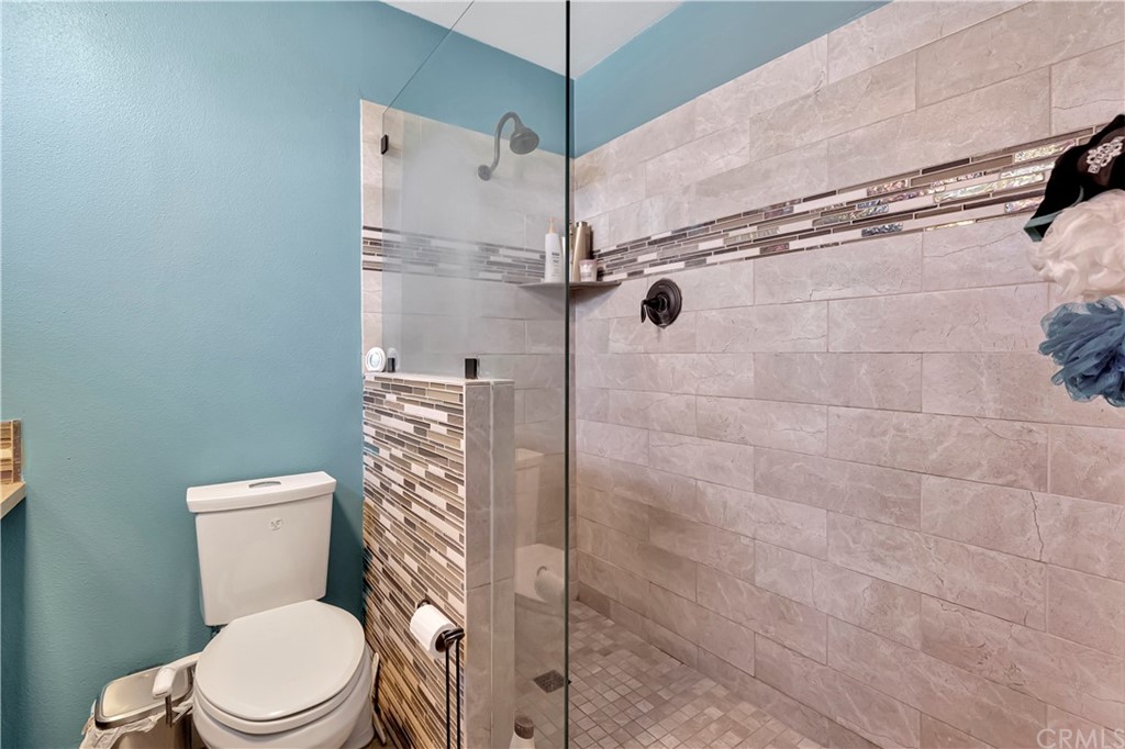 23682 Cavanaugh Road Lake Forest, CA 92630 - Photo 31 of 51 a white toilet sitting next to a shower