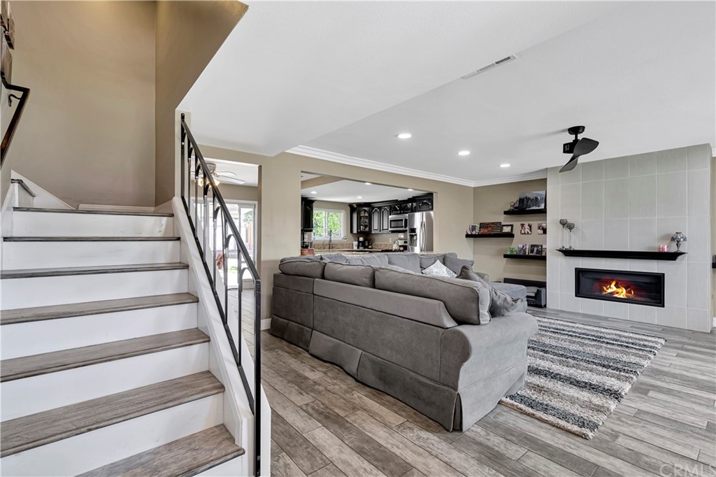 23682 Cavanaugh Road Lake Forest, CA 92630 - Photo 32 of 51 a living room with furniture and a fireplace