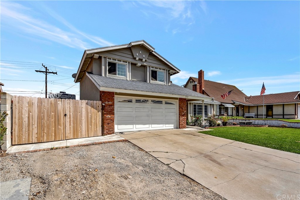 23682 Cavanaugh Road Lake Forest, CA 92630 - Photo 4 of 51 a front view of a house with a yard and garage