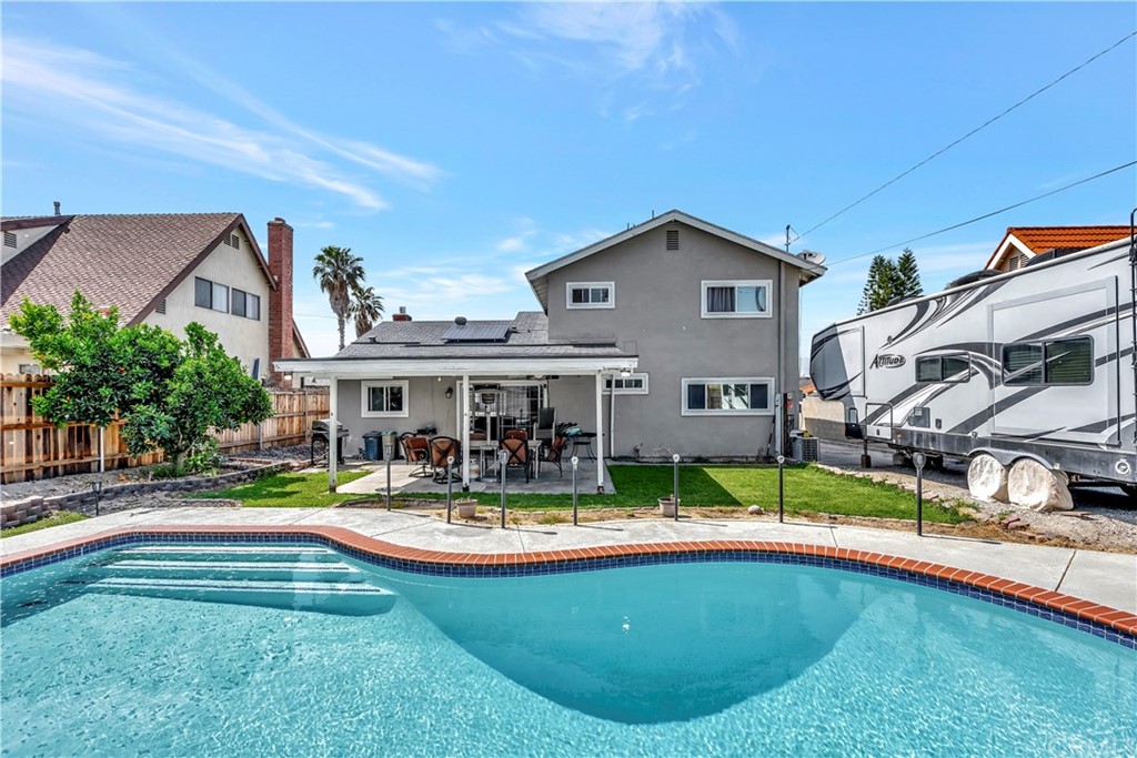23682 Cavanaugh Road Lake Forest, CA 92630 - Photo 42 of 51 a view of house with a yard and swimming pool