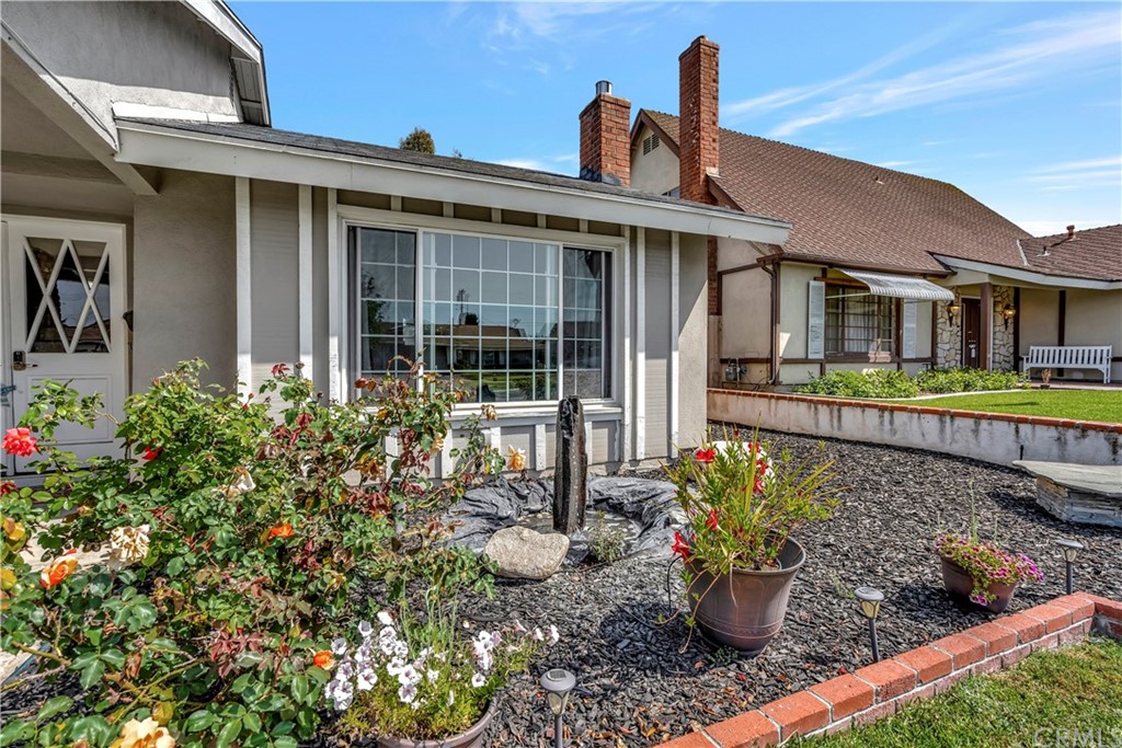 23682 Cavanaugh Road Lake Forest, CA 92630 - Photo 5 of 51 a front view of a house with a garden