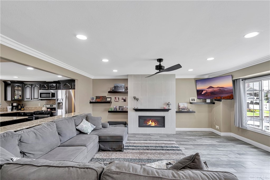 23682 Cavanaugh Road Lake Forest, CA 92630 - Photo 7 of 51 a living room with furniture and a fireplace