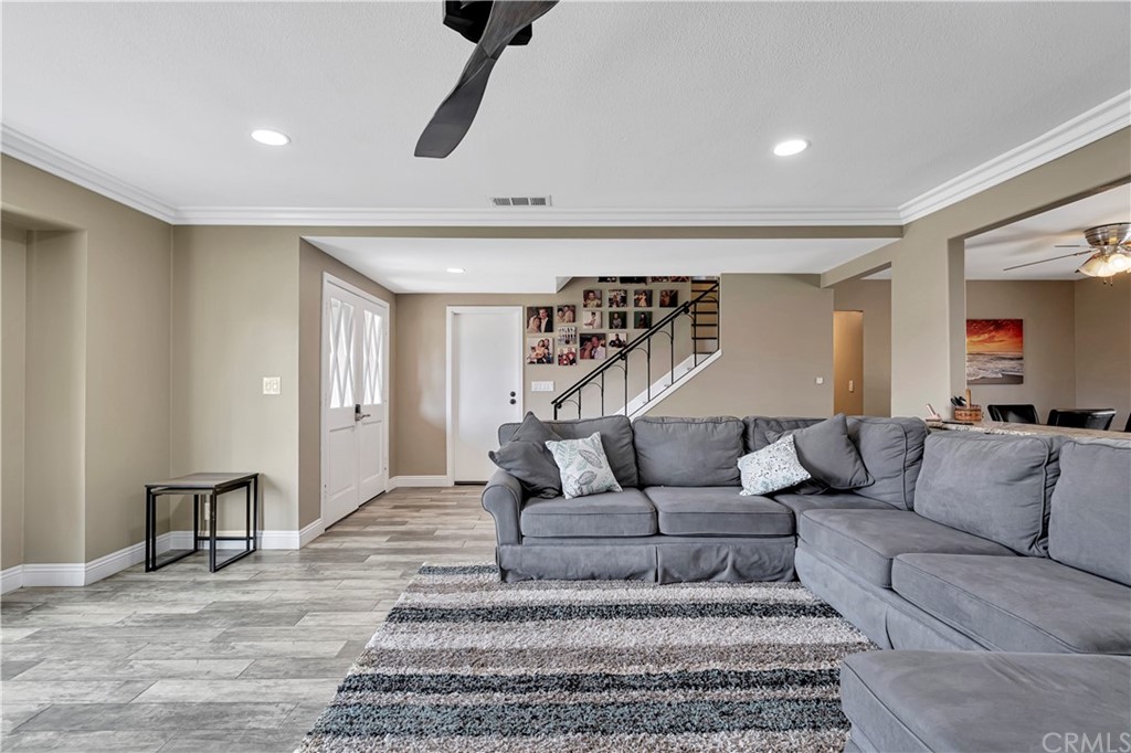 23682 Cavanaugh Road Lake Forest, CA 92630 - Photo 10 of 51 a living room with furniture and a ceiling fan