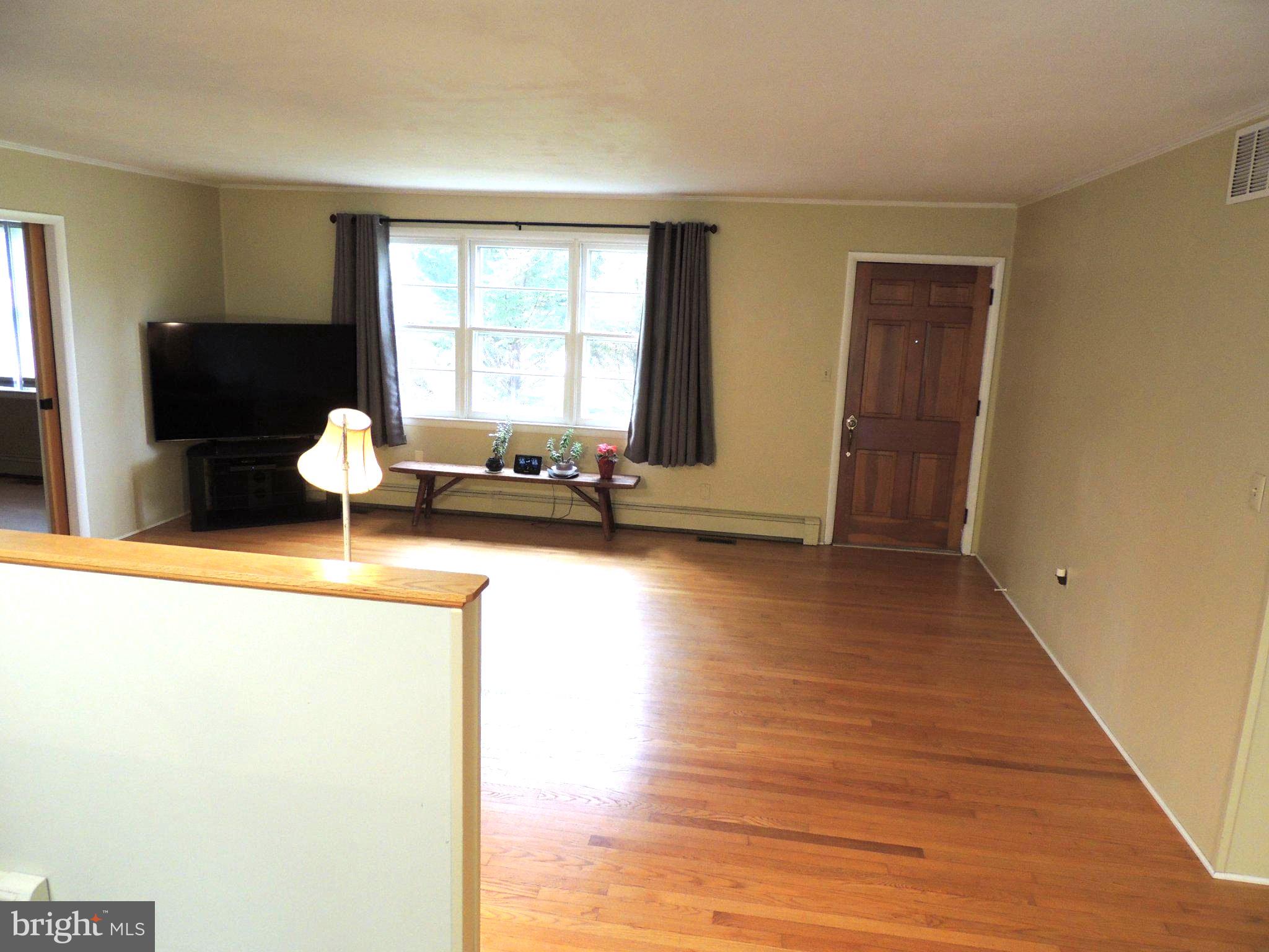 5838 Oklahoma Road Sykesville, MD 21784 - Photo 19 of 72 Spacious living area with natural light.
