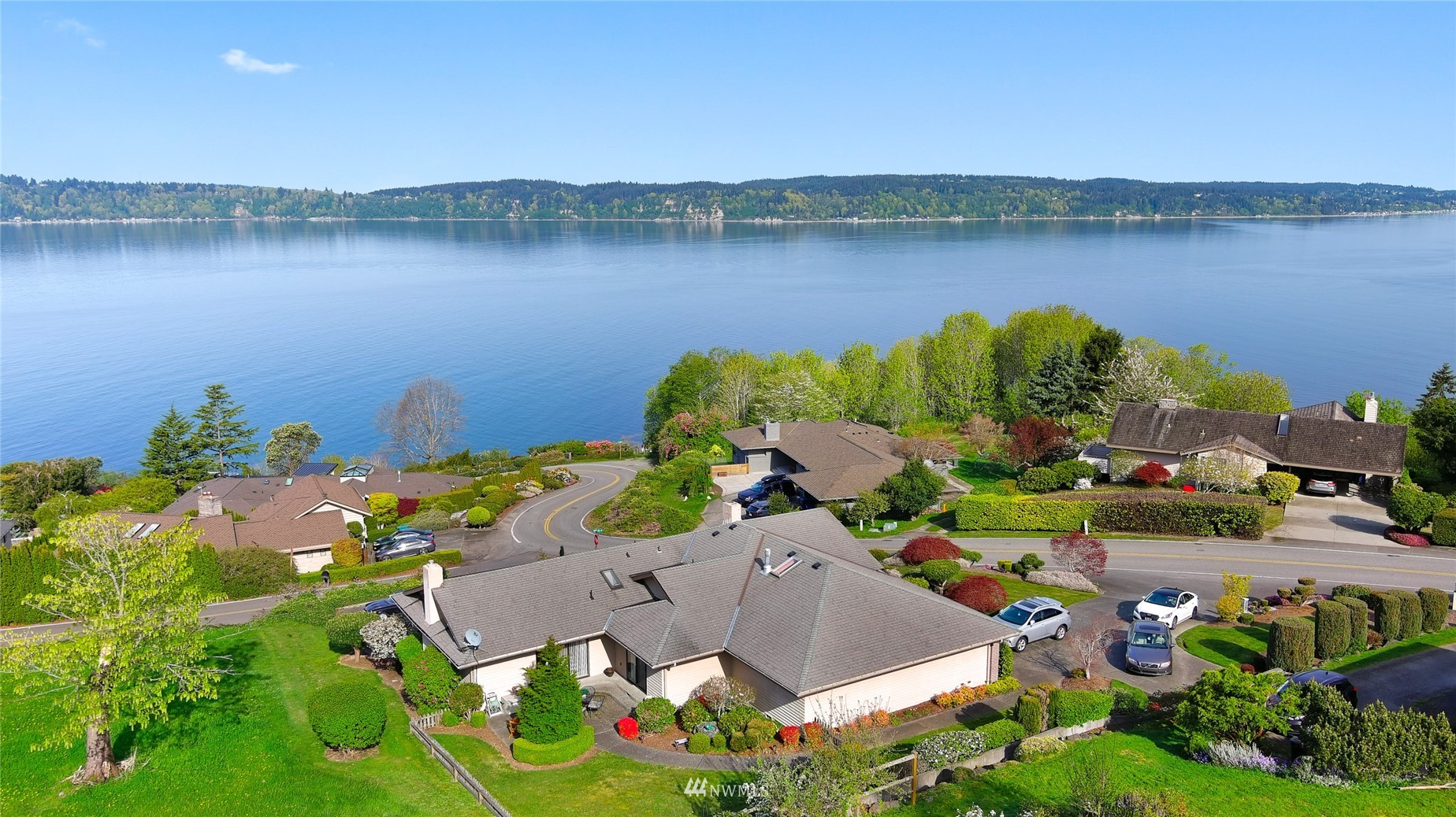 a aerial view of a house with a lake view