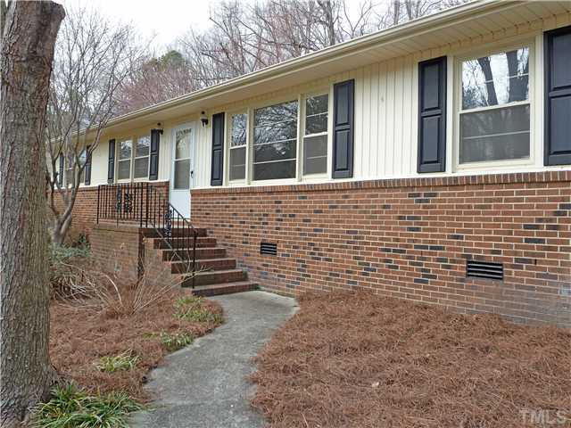 Winding path to front porch. New vinyl double hung windows in 2001. Fresh pinestraw in landscaping beds. Exterior Front