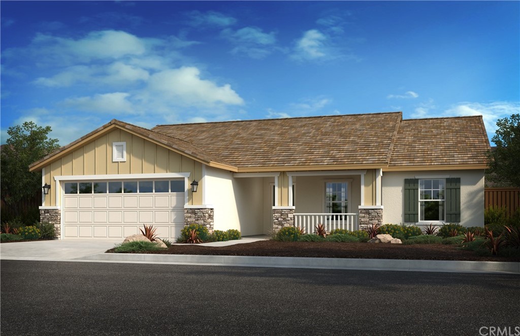 a front view of house with garage and yard