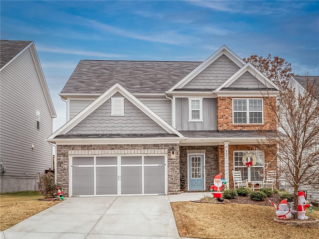 a front view of a house with a garage