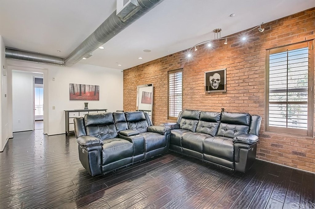 326 District Court Fullerton, CA 92832 - Photo 16 of 41 a living room with furniture and wooden floor