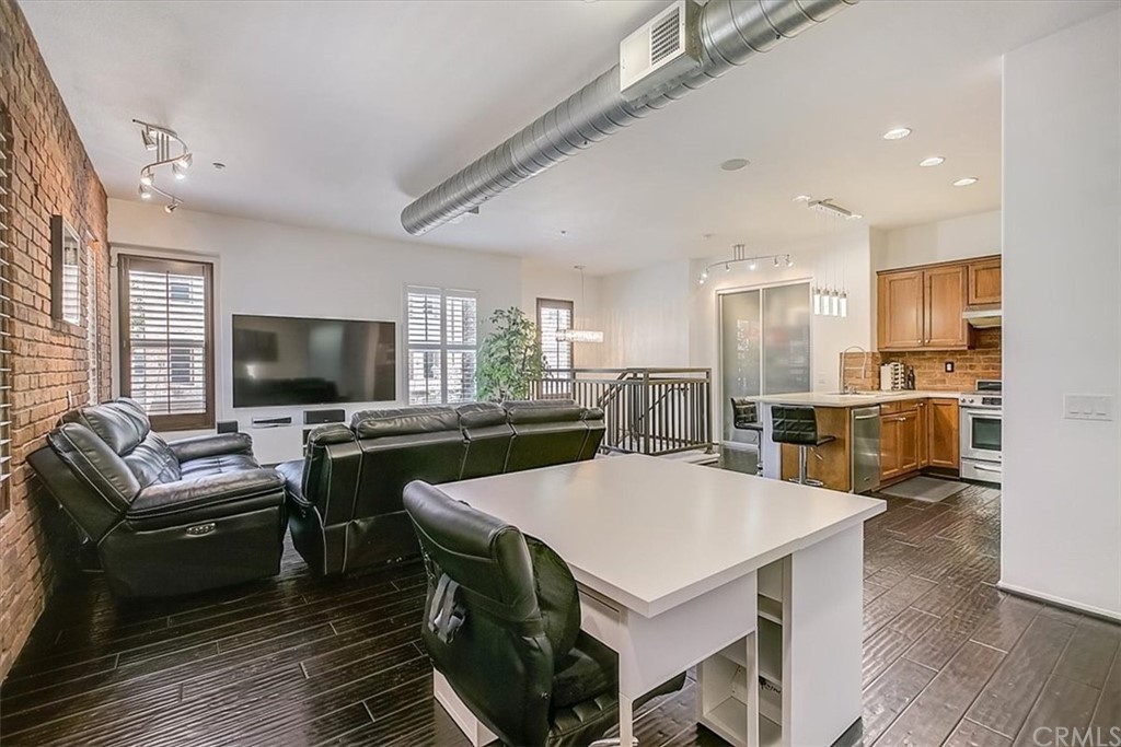 326 District Court Fullerton, CA 92832 - Photo 20 of 41 a living room with stainless steel appliances furniture a flat screen tv and kitchen view