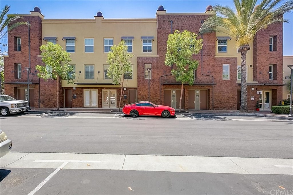326 District Court Fullerton, CA 92832 - Photo 2 of 41 a view of a brick building next to a road