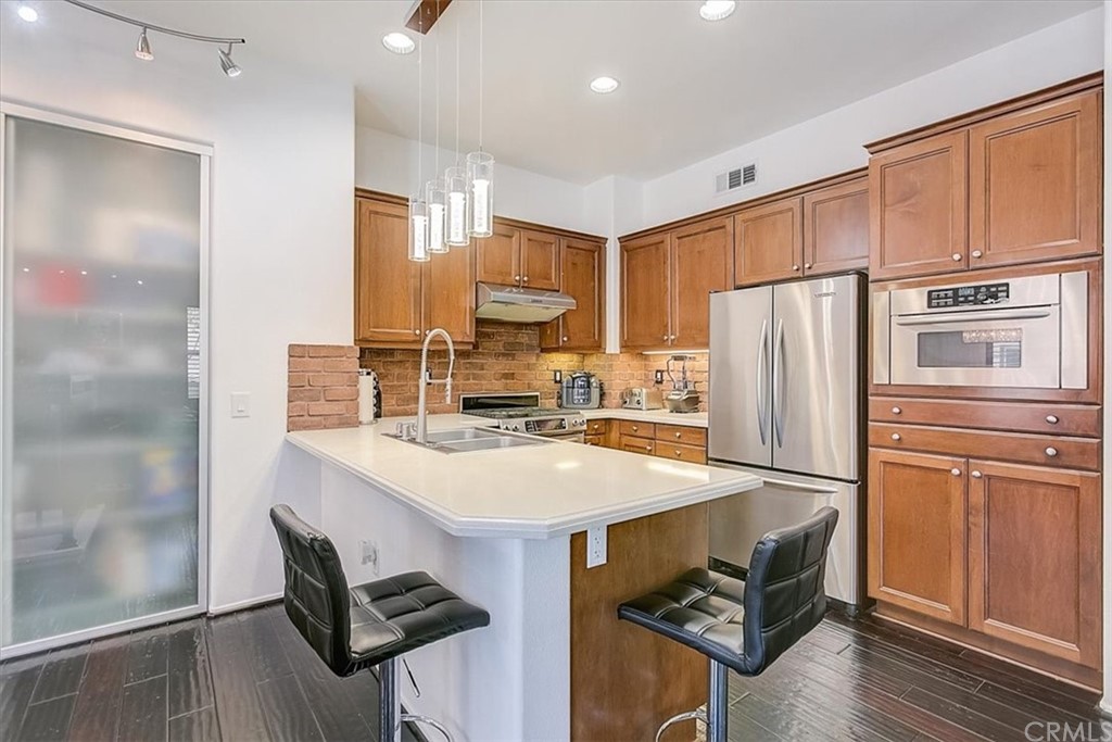 326 District Court Fullerton, CA 92832 - Photo 21 of 41 a kitchen with stainless steel appliances a refrigerator and a stove