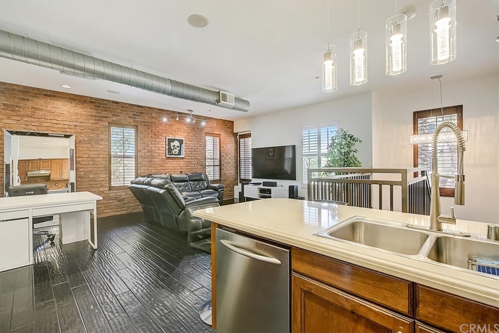 326 District Court Fullerton, CA 92832 - Photo 24 of 41 a kitchen with a table chairs refrigerator and cabinets