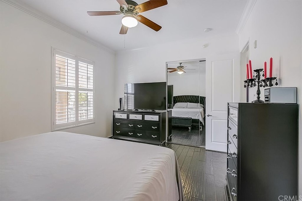 326 District Court Fullerton, CA 92832 - Photo 32 of 41 a bedroom with a bed and a chandelier