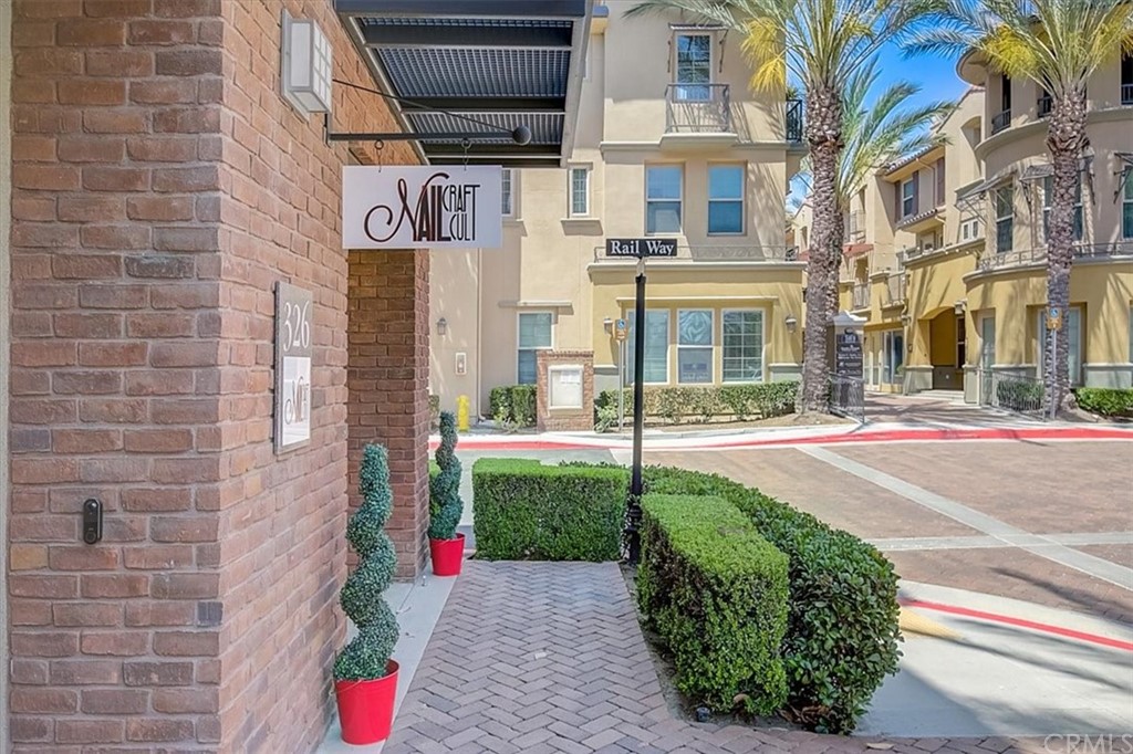 326 District Court Fullerton, CA 92832 - Photo 37 of 41 a view of a brick building next to a yard