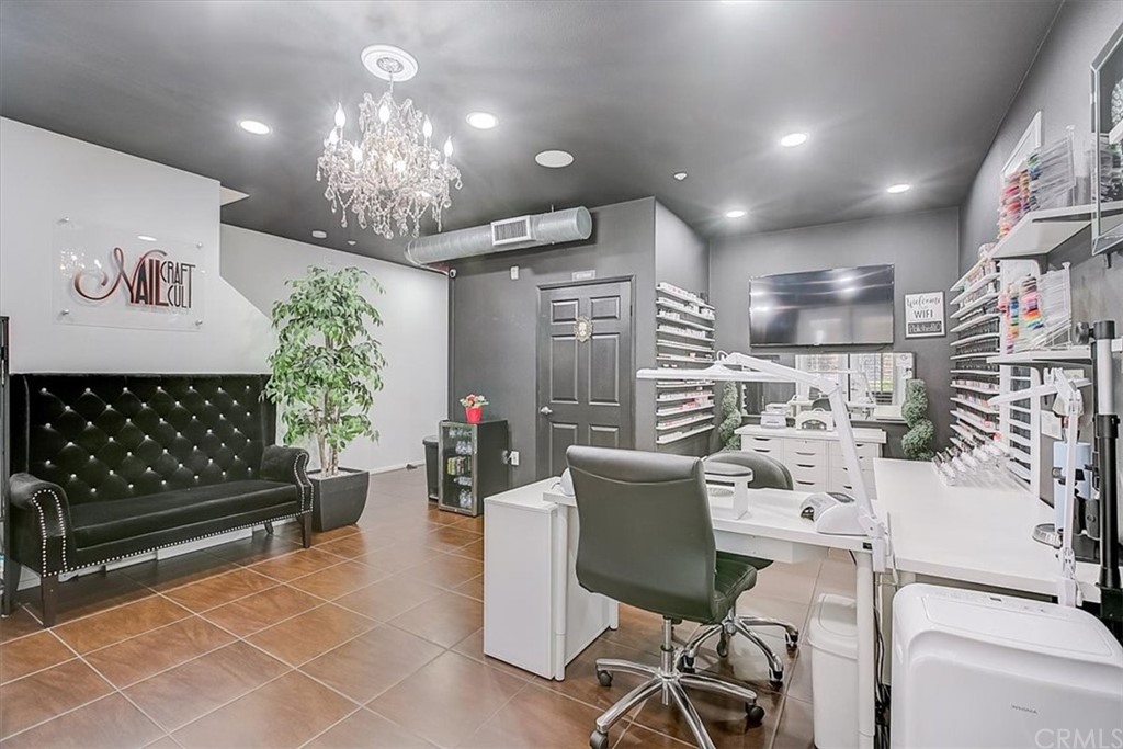 326 District Court Fullerton, CA 92832 - Photo 5 of 41 a view of a dining room with furniture a chandelier and wooden floor
