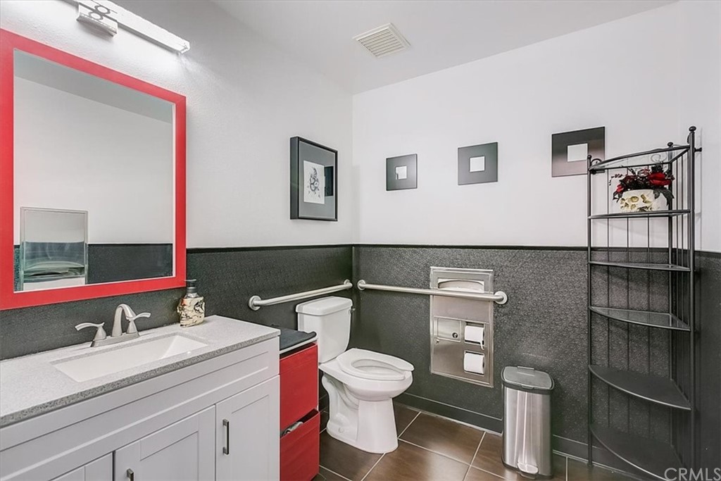326 District Court Fullerton, CA 92832 - Photo 9 of 41 a bathroom with a toilet sink and mirror