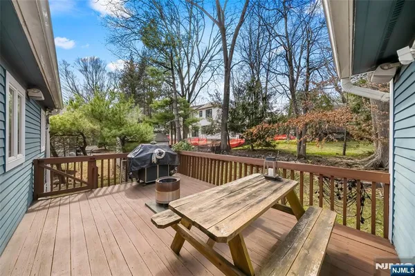 a view of a wooden deck with chairs