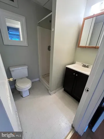 a bathroom with a toilet and a sink