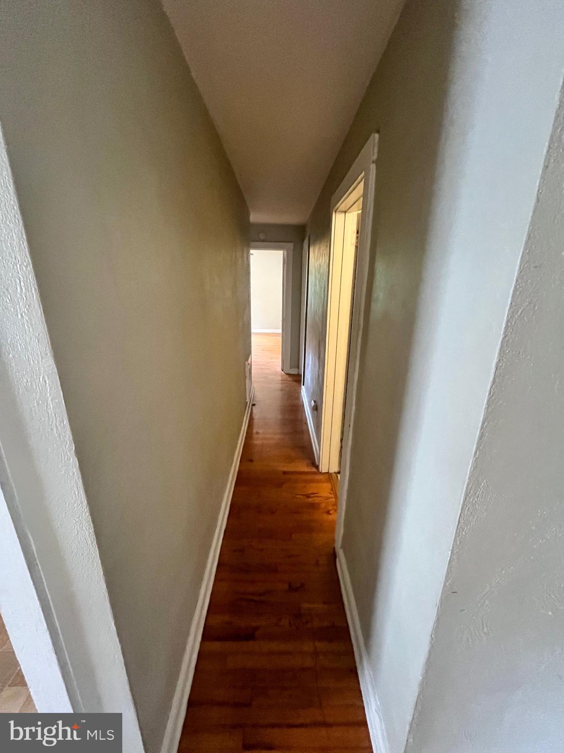 11 New Street, Unit 4 Newark, DE 19711 - Photo 10 of 16 a view of a hallway with wooden floor and staircase