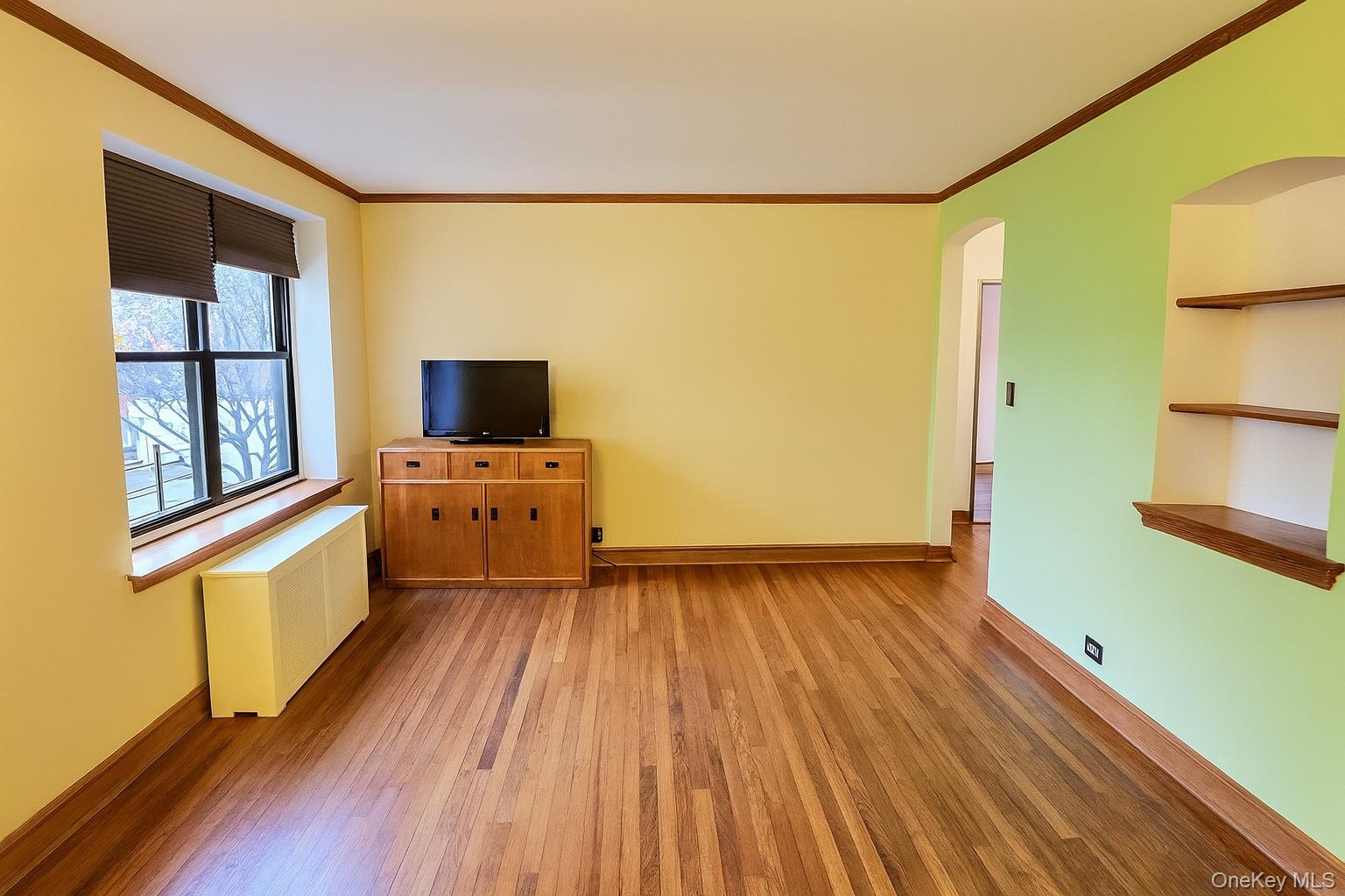 21-41 78th Street, Unit 1 Queens, NY 11370 - Photo 3 of 10 a view of a room with wooden floor and floors