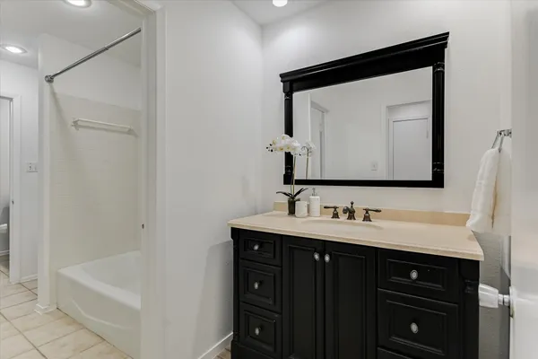 a bathroom with a double vanity sink and mirror
