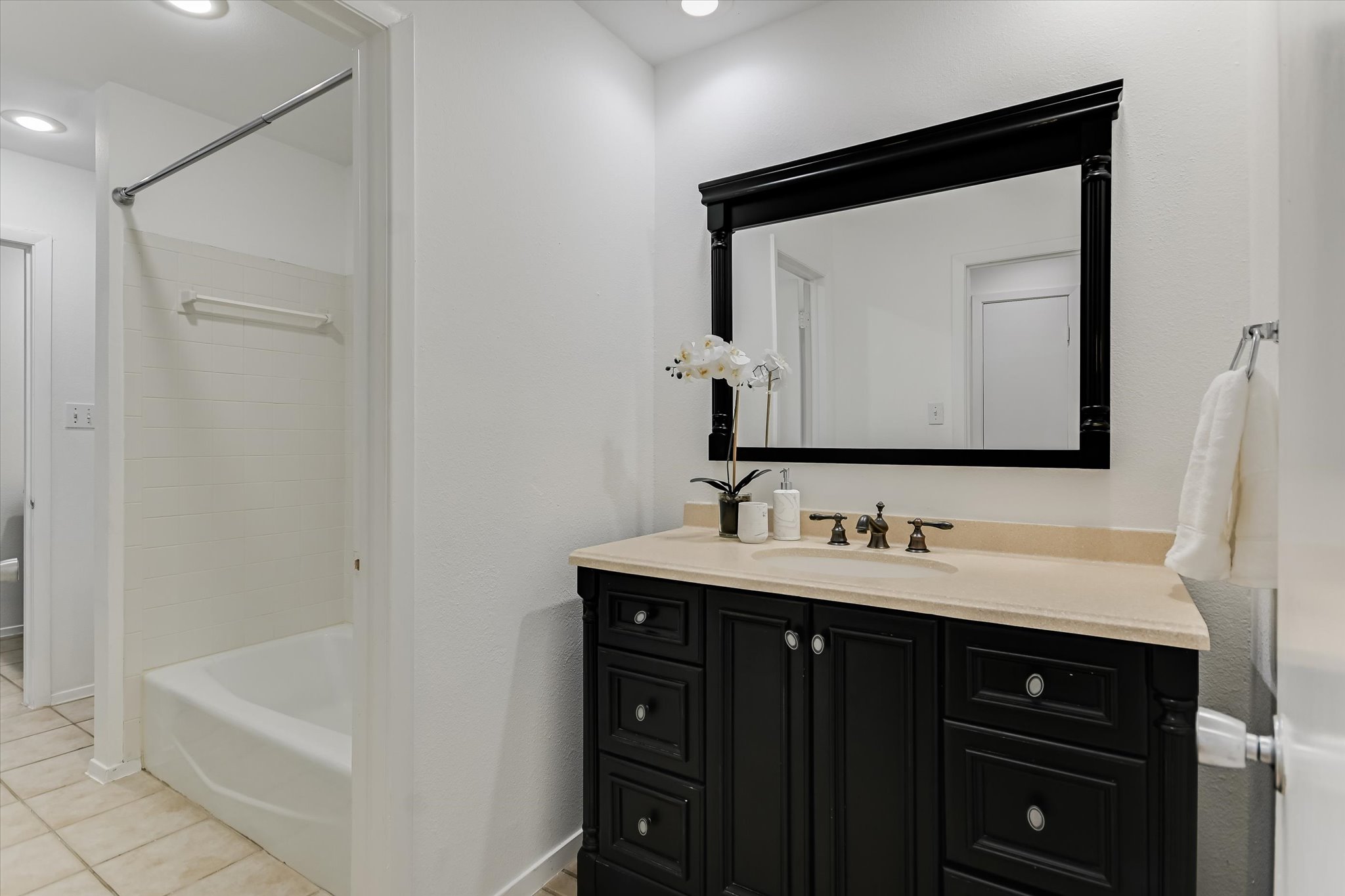 3207 Eanes Circle, Unit A Austin, TX 78746 - Photo 7 of 14 a bathroom with a double vanity sink and mirror