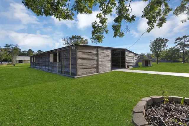 a backyard of a house with lots of green space