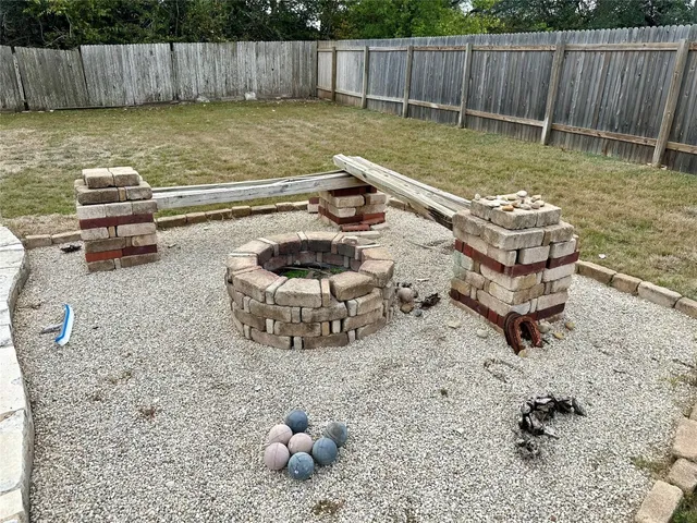 a backyard of a house with yard and outdoor seating