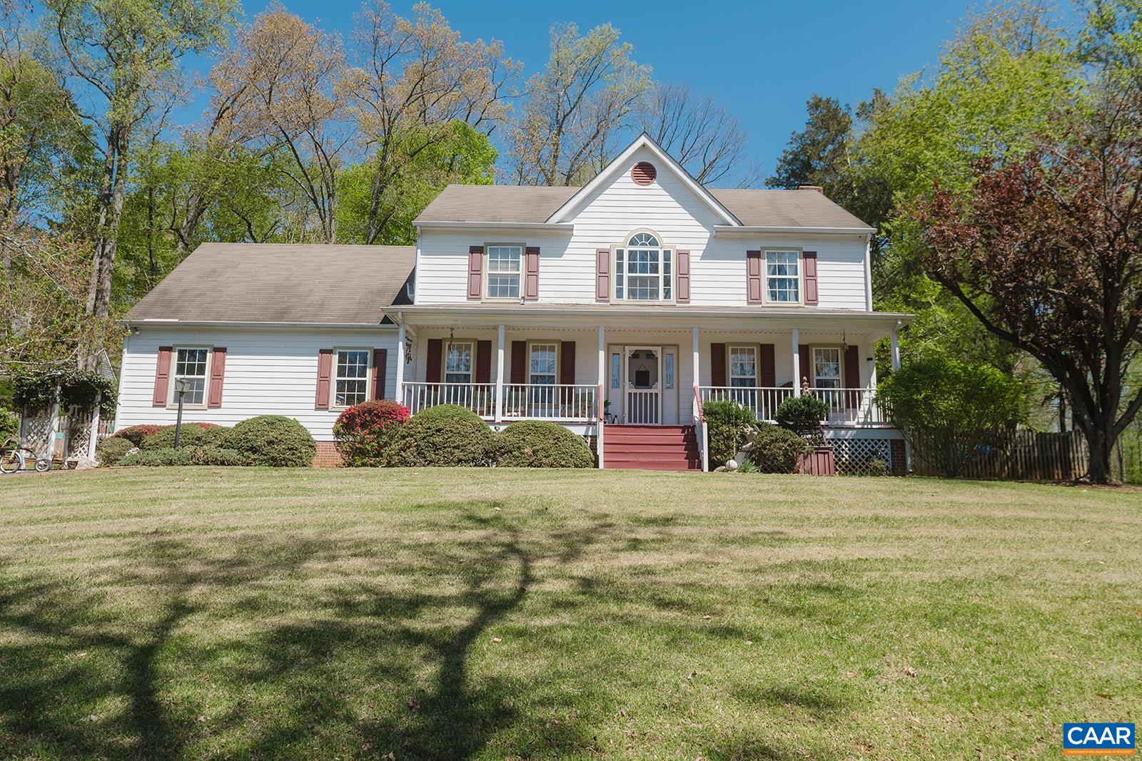 1642 Polo Grounds Road Charlottesville, VA 22911 - Photo 1 of 44 a front view of a house with a garden