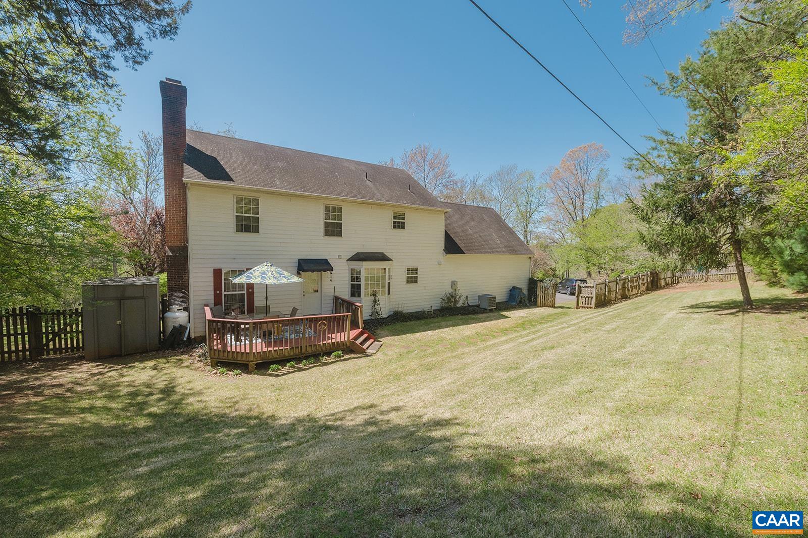 1642 Polo Grounds Road Charlottesville, VA 22911 - Photo 14 of 44 a view of a white house with a big yard
