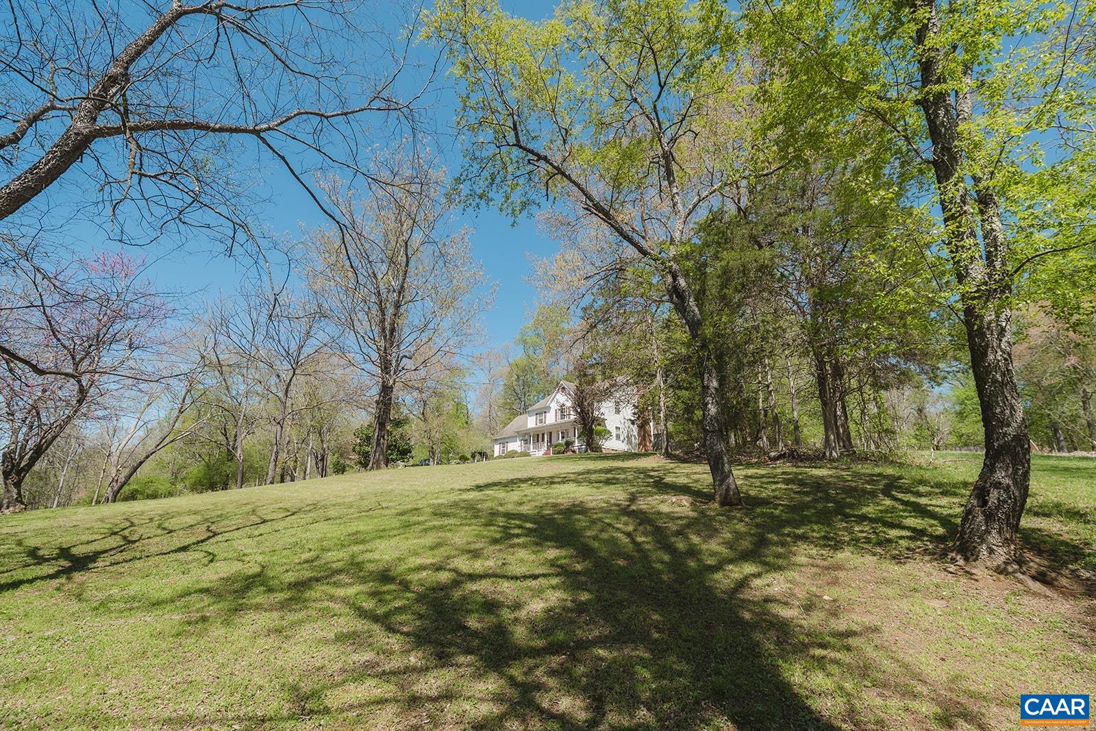 1642 Polo Grounds Road Charlottesville, VA 22911 - Photo 2 of 44 a big yard with trees