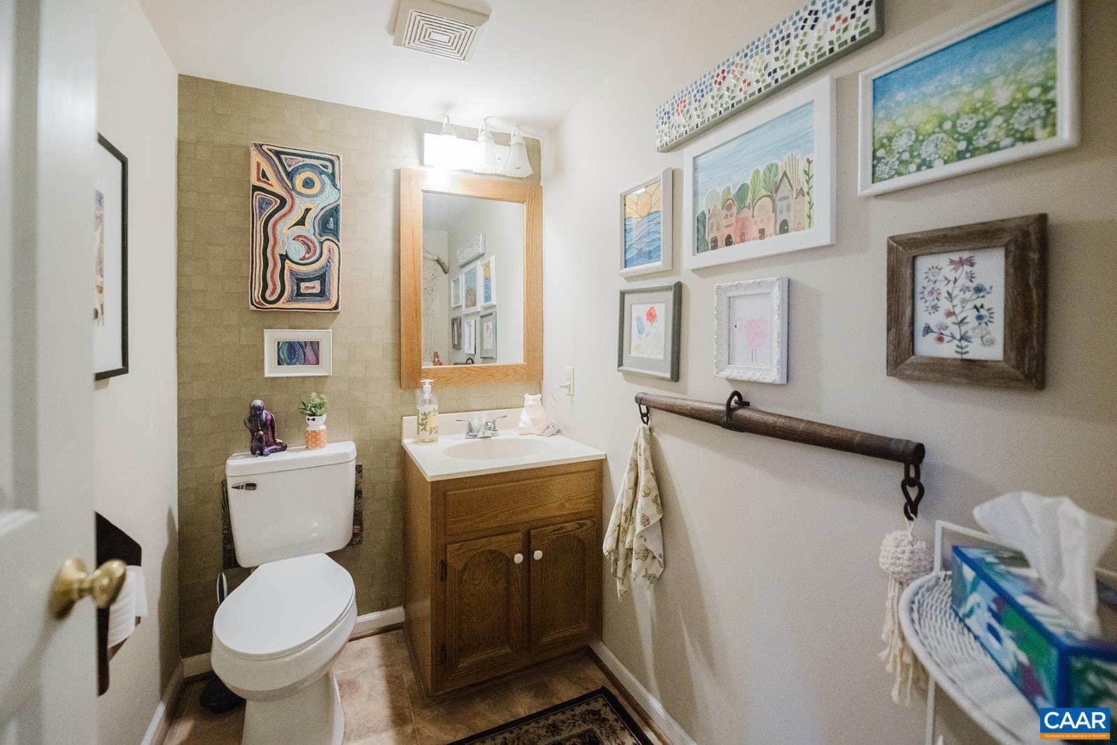 1642 Polo Grounds Road Charlottesville, VA 22911 - Photo 24 of 44 a bathroom with a toilet a sink and a mirror