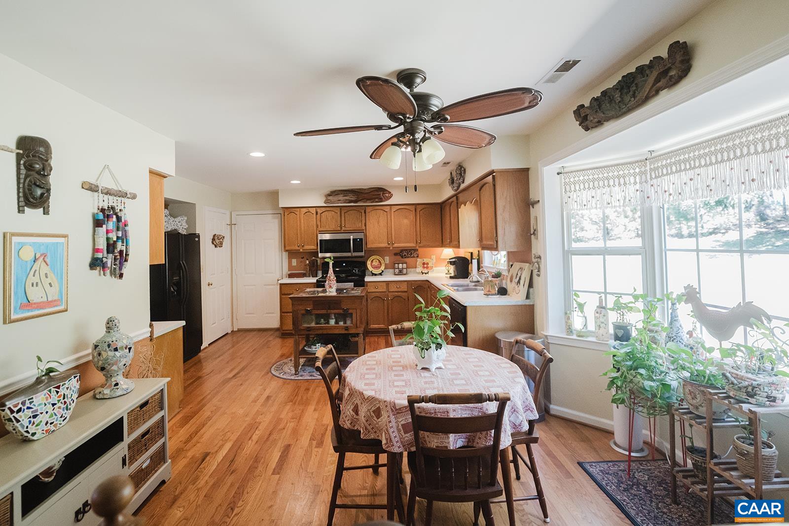 1642 Polo Grounds Road Charlottesville, VA 22911 - Photo 27 of 44 a view of a dining room with furniture window and wooden floor