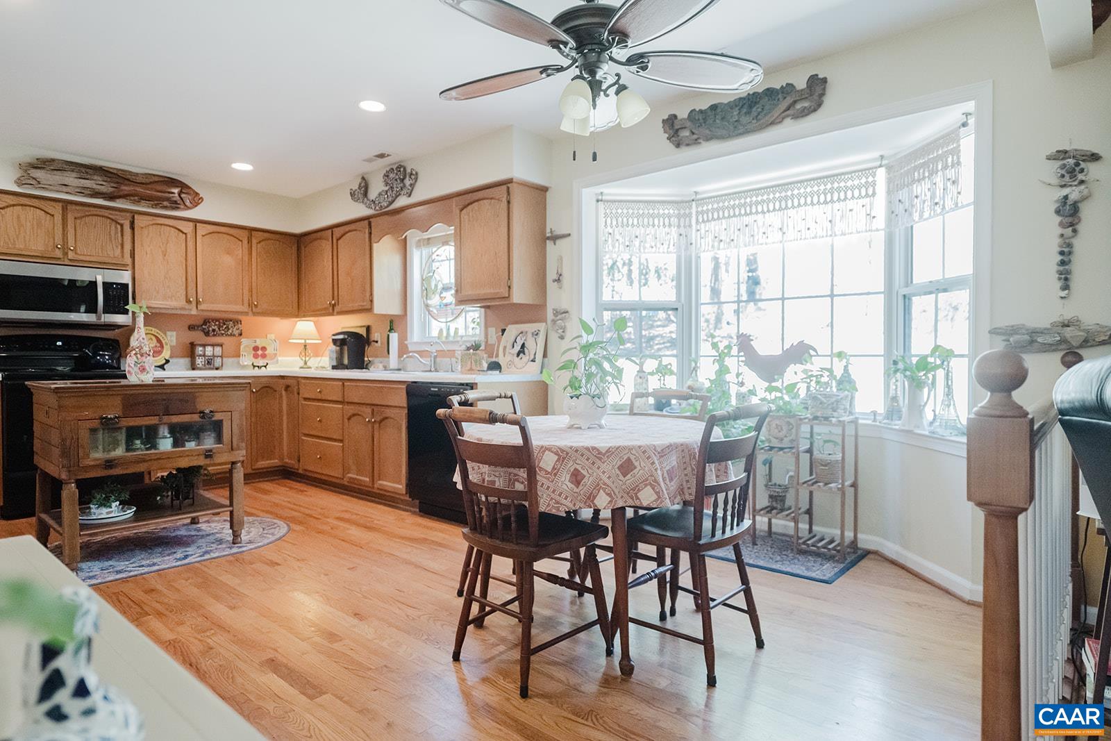 1642 Polo Grounds Road Charlottesville, VA 22911 - Photo 28 of 44 a view of a dining room with furniture window and wooden floor