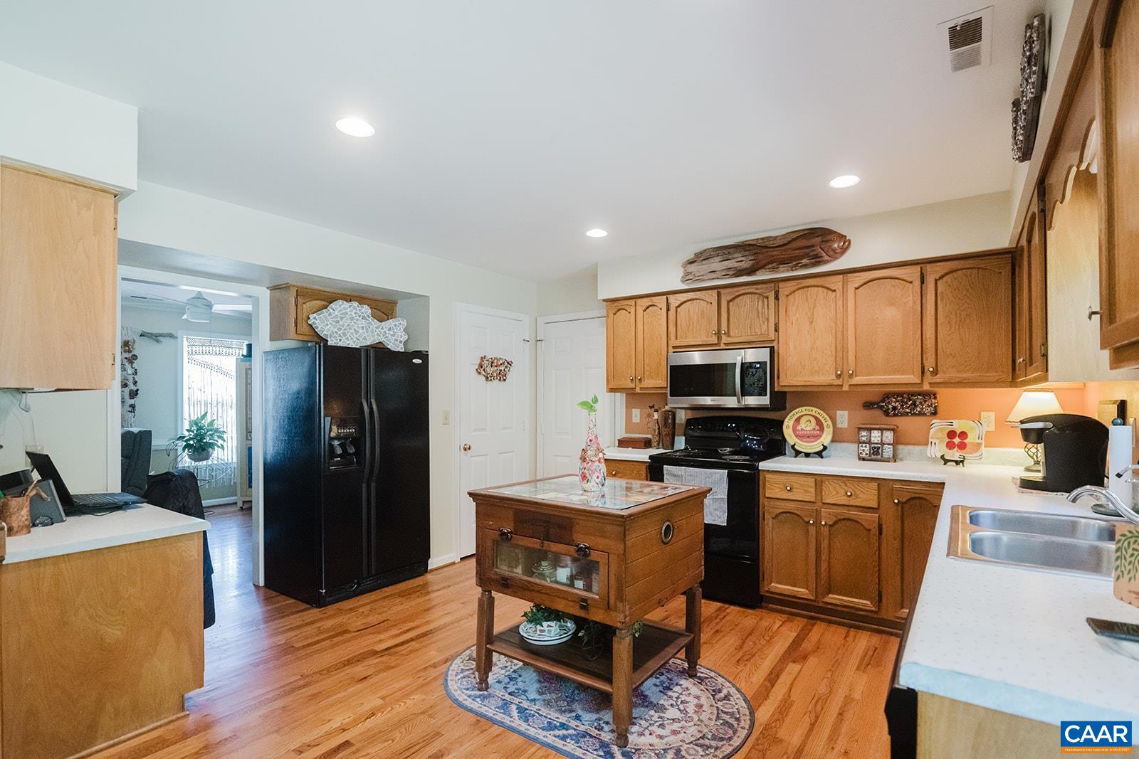 1642 Polo Grounds Road Charlottesville, VA 22911 - Photo 29 of 44 a kitchen with stainless steel appliances granite countertop a refrigerator stove top oven and sink