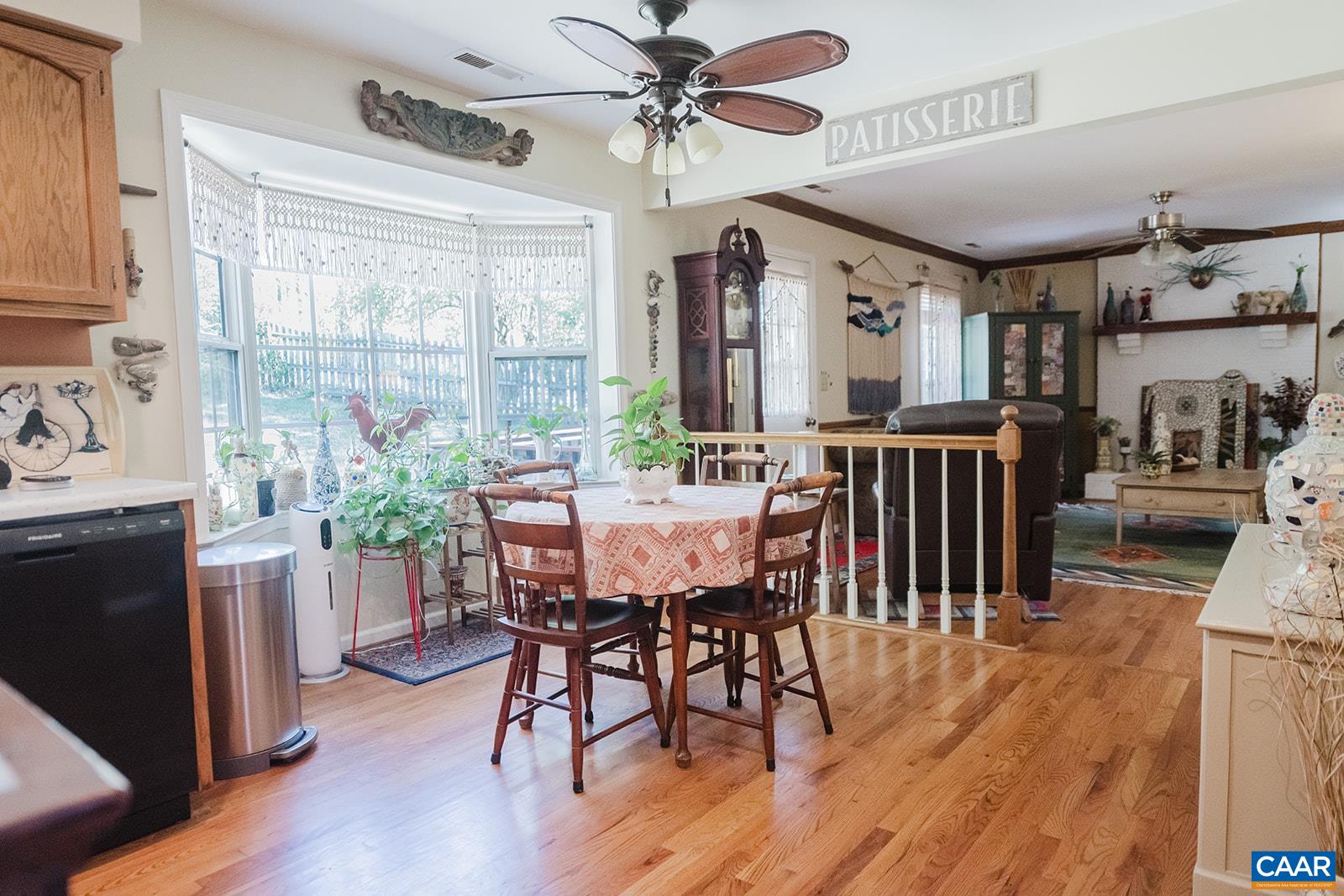 1642 Polo Grounds Road Charlottesville, VA 22911 - Photo 31 of 44 a view of a dining room with furniture window and wooden floor