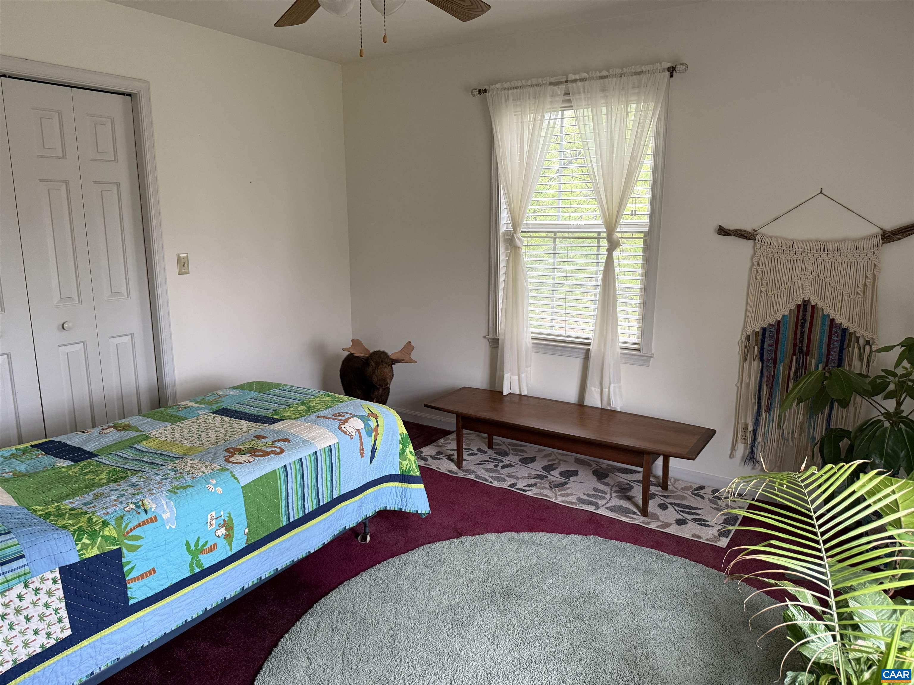 1642 Polo Grounds Road Charlottesville, VA 22911 - Photo 39 of 44 a bedroom with a bed and a window