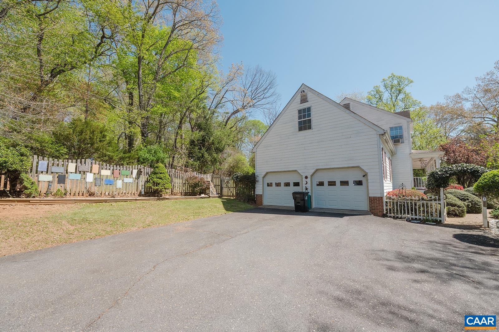 1642 Polo Grounds Road Charlottesville, VA 22911 - Photo 7 of 44 a view of a house with a yard and garage