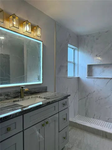 a bathroom with a sink and a mirror