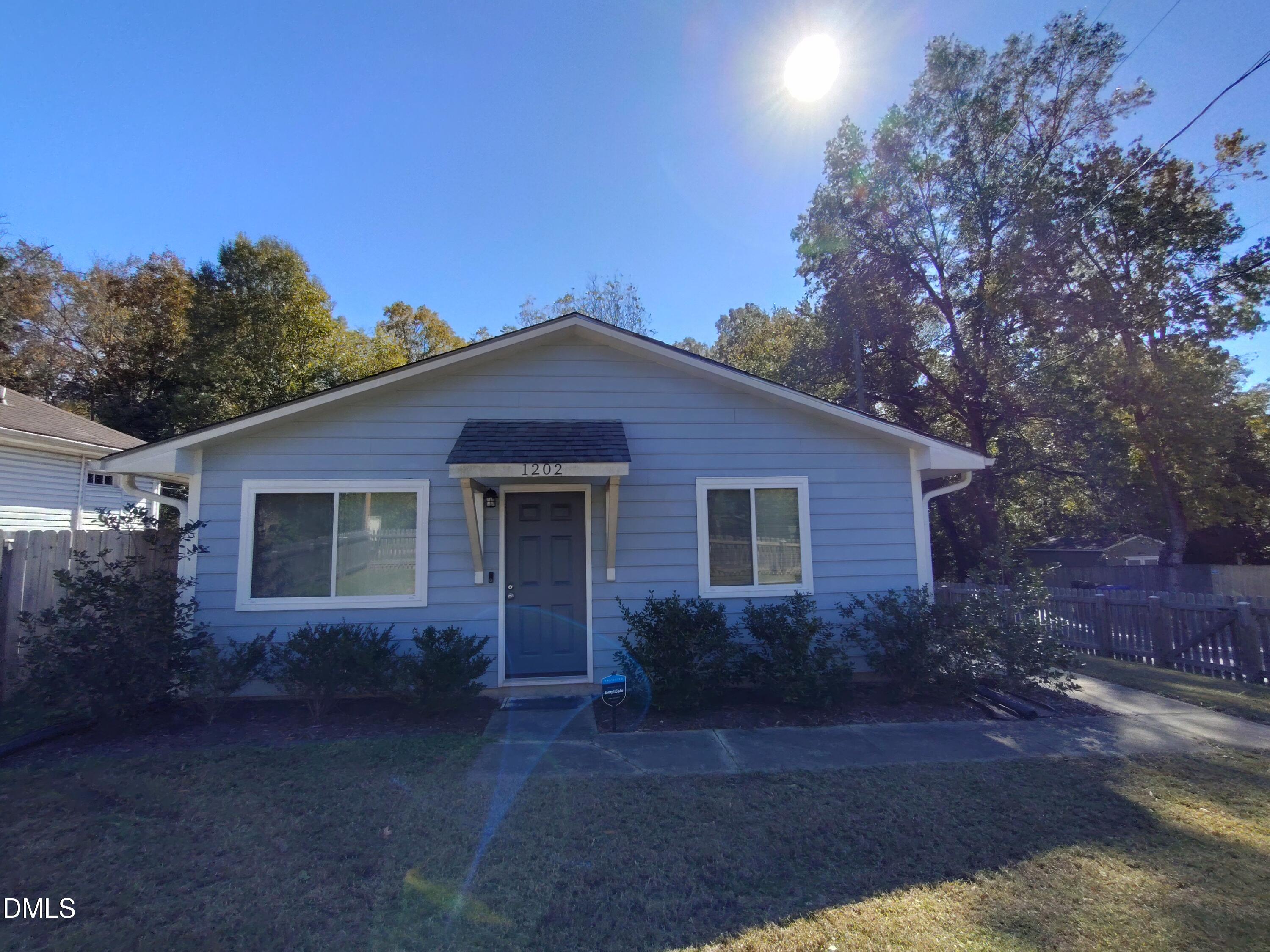 1202 Liberty Street Durham, NC 27703 - Photo 2 of 14 a view of a house with a yard