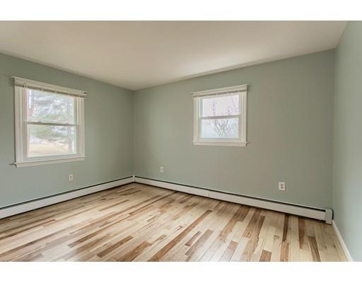 42 Corey Hill Road Ashburnham, MA 01430 - Photo 16 of 27 a view of an empty room with wooden floor and a window
